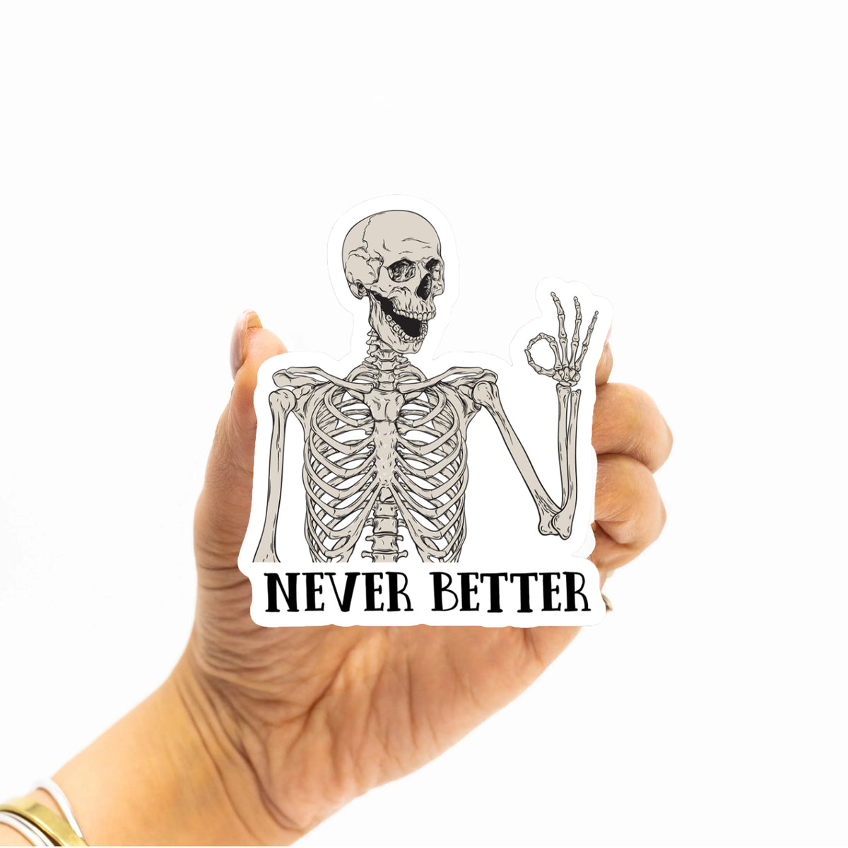 Hand holding a custom die-cut vinyl sticker with protective gloss laminate