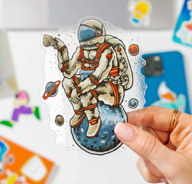 Custom clear die-cut astronaut sticker printed on transparent vinyl